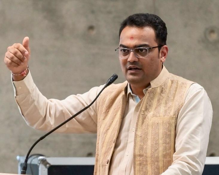 A man delivering an inspiring speech at a conference on education and motivation.